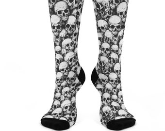 May include: A pair of black socks with a white skull pattern. The socks are made of a soft, comfortable material and are perfect for everyday wear.