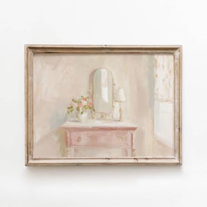 May include: A framed painting depicts a pink dresser with a mirror, lamp, and vase of flowers. The artwork has a soft, pastel color palette with a vintage aesthetic. The painting is framed in a light brown wooden frame.
