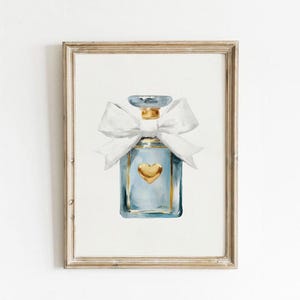 May include: A watercolor painting of a blue perfume bottle with a gold top and a white bow. The bottle has a gold heart on the front.