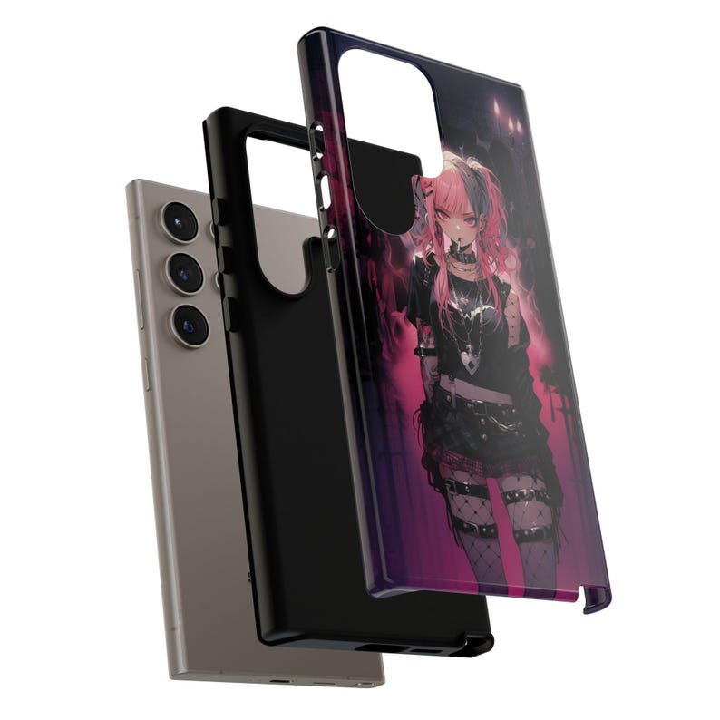 May include: A black phone case with a colorful anime character design. The character has pink hair and is wearing a black outfit with a white heart on the chest. The case has a raised camera bump and a black border.