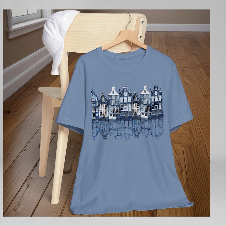 Netherlands Travel Shirt Amsterdam Canal Houses Design Dutch Heritage Gift Delft Blue Tee Holland Souvenir Apparel Unisex Jersey Cotton Comfortable Casual Wear Architecture Print European Culture Gift World Traveler Tshirt Amsterdam Design
