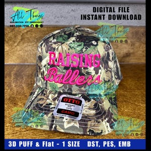 May include: A camouflage baseball cap with the words "RAISING Ballers" embroidered in pink. The cap has a curved brim and a tag that reads "OTTO Classic Fit Camo". The hat is one size and is a digital file.