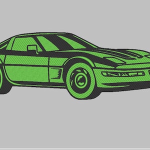 May include: A green and black embroidered illustration of a classic sports car. The car features a sleek design with a low profile, visible headlights, and detailed wheels. The image is set against a gray background.