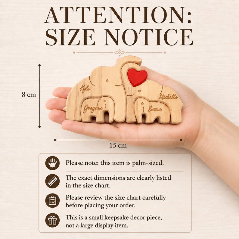 May include: Wooden elephant family keepsake, 15 cm long and 8 cm tall, with a red heart and engraved names. The image includes the text "ATTENTION: SIZE NOTICE".