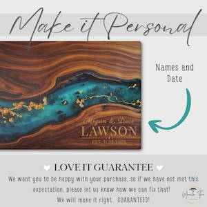May include: A personalized wooden cutting board with a unique design. The board features a river of teal resin with gold accents flowing through a rich brown wood grain. The names "Megan & Dave Lawson" and the date "EST. 11.28.2025" are engraved on the board.