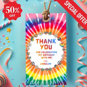 May include: A tie-dye gift tag with a rainbow design and the words "THANK YOU" in large letters. The tag is decorated with daisies, peace signs, and hearts. The text "FOR CELEBRATING MY BIRTHDAY WITH ME! LOVE, CAROLYN" is also included. A red banner reads "SPECIAL OFFER".