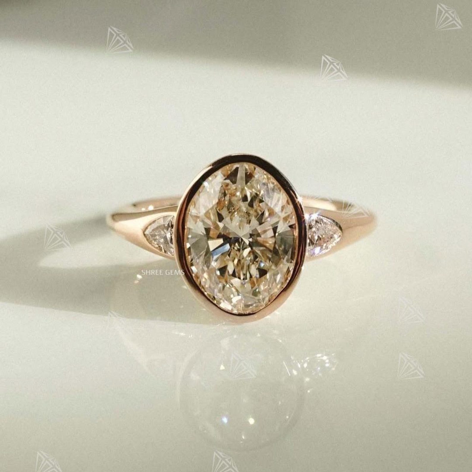 Grayson Rozell Rings 18K Rose Gold Oval Engagement Ring, Three Stone Bezel Set Trillion Side ...