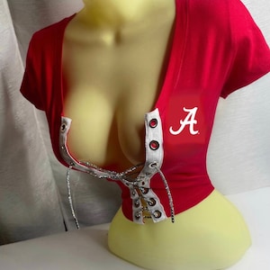 May include: Red crop top with a white lace-up front and a white "A" logo on the right side.