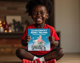 May include: A smiling child in a red shirt holds a book titled "Ellie & Santa's Secret Helpers: A Magical Christmas Adventure." The book cover features an illustration of a person and an animal riding a motorcycle with a sidecar.