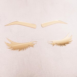 gold acrylic brow and lash beauty salon decor