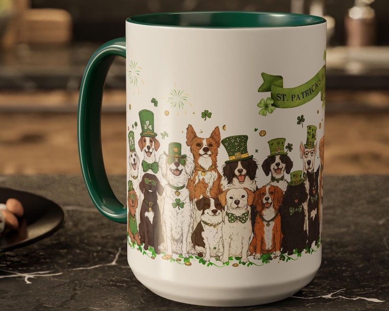 May include: White ceramic mug with a green rim and handle. The mug features a design of dogs wearing green hats and shamrocks with the text "St. Patrick's Day" on the side.