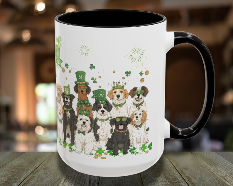 May include: White ceramic coffee mug with a black handle. The mug features a colorful illustration of dogs wearing shamrock hats and green clothing. The dogs are surrounded by shamrocks and gold coins.