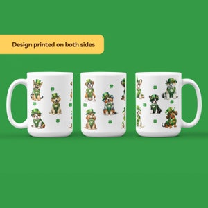 May include: White ceramic mug with a design of various dogs wearing green shamrock hats and green scarves. The design is repeated on both sides of the mug.