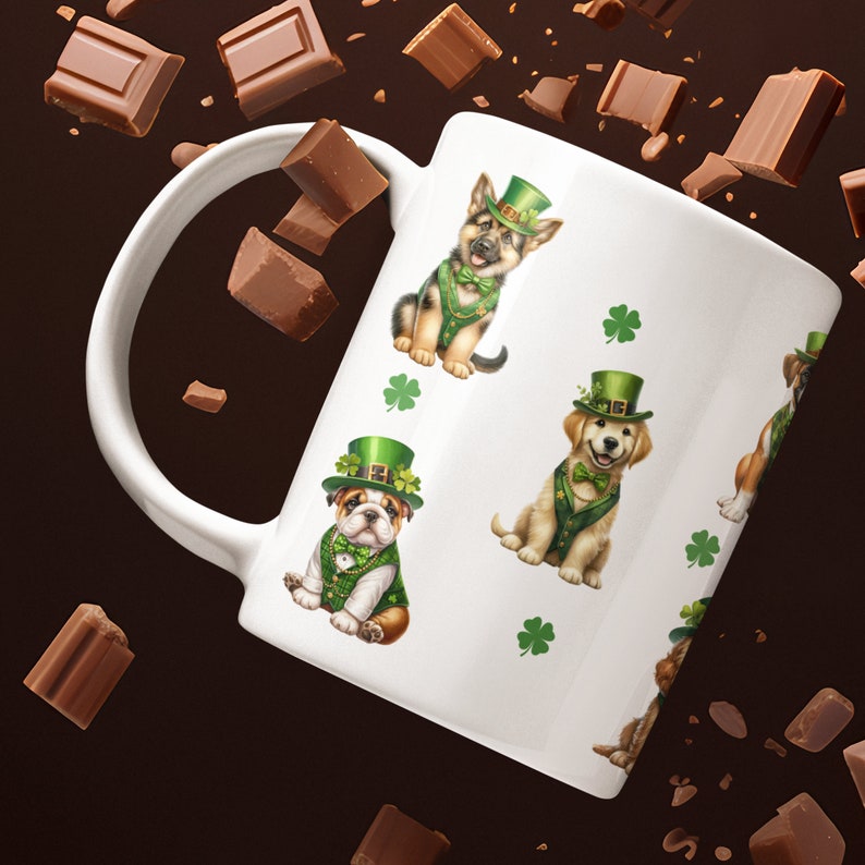 May include: White ceramic mug with a repeating pattern of four different dogs wearing green shamrock hats and green vests. The dogs are a bulldog, a golden retriever, a German shepherd, and a terrier. The background is white with green shamrocks.