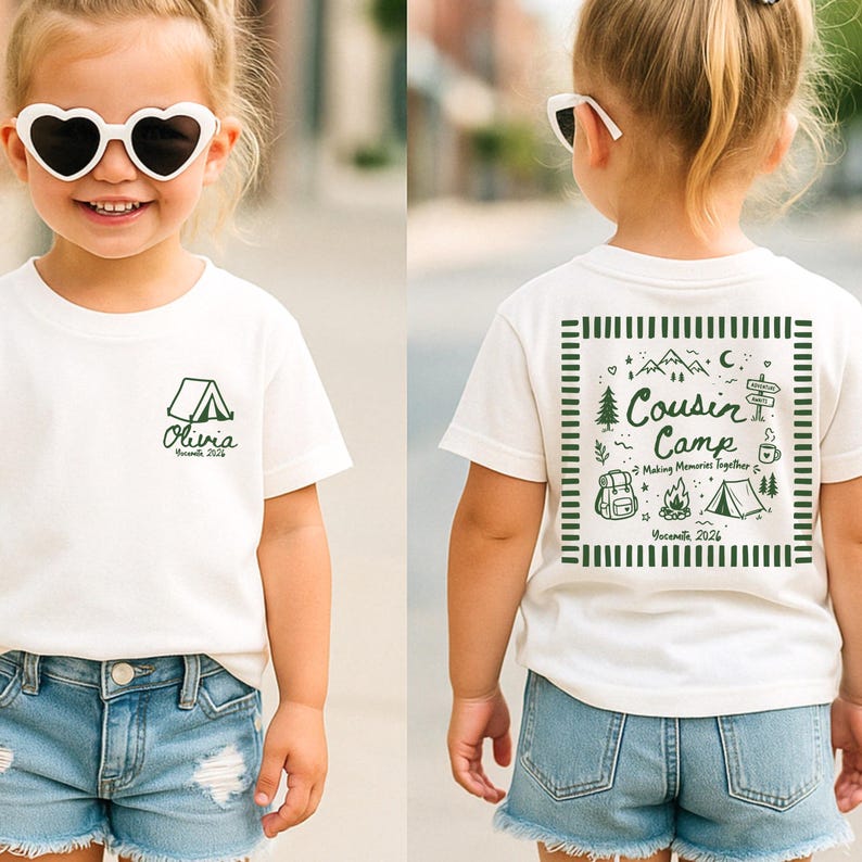 May include: A white short-sleeved t-shirt featuring a small green tent graphic and the text Olivia Yosemite 2026 on the front. The back displays a large green graphic with the text Cousin Camp Making Memories Together Yosemite 2026.
