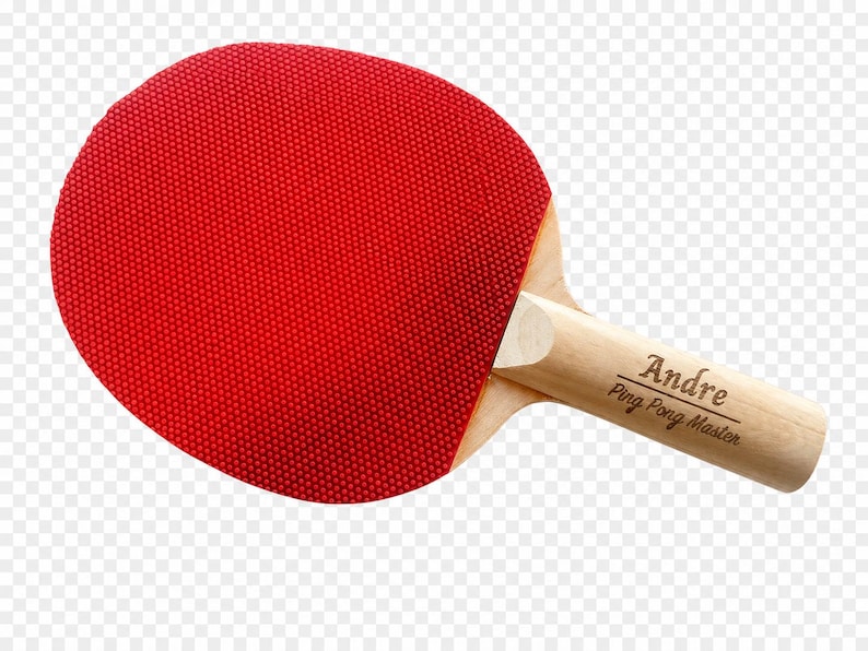 May include: A red ping pong paddle with a wooden handle. The paddle's face is a vibrant red with a textured surface. The handle is light-colored wood, with the name "Andre" and "Ping Pong Master" printed on it.