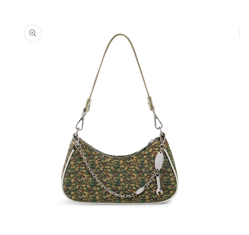 May include: A green and brown camouflage print shoulder bag with a silver chain and a small wrench charm. The bag has a white trim and a thin olive green strap.