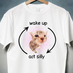 Wake Up Act Silly Shirt, Crying Banana Cat Meme, Sad Kitty Cat, El Gato, Zoning Out Black Cat, Thumbs Up Cat, Weirdcore, Cringey Shirts