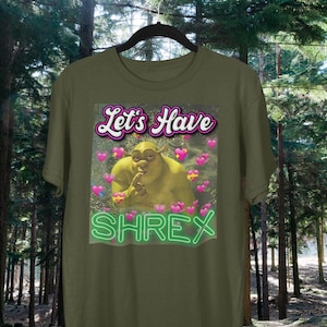 May include: A green t-shirt with a graphic of Shrek with the text "Let's Have Shrex" in a neon green font.