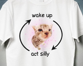 Camiseta "Wake Up Act Silly", meme del gato plátano llorando, gatito triste, El Gato, gato negro desconectado, gato con pulgares arriba, camisetas raras, camisetas vergonzosas