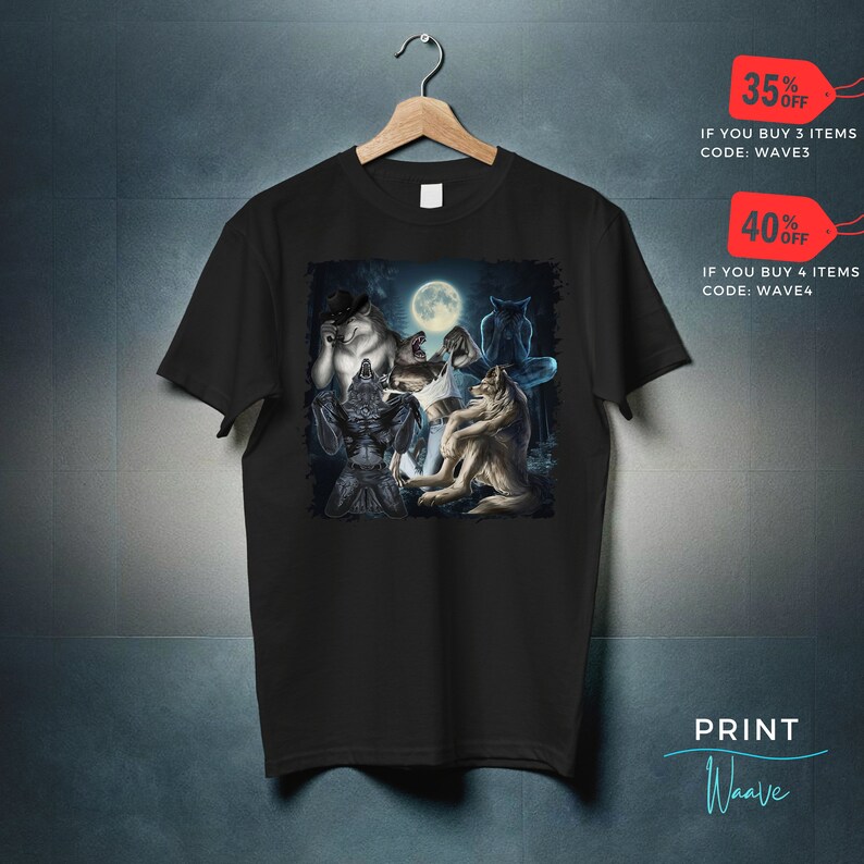 May include: Black t-shirt featuring a fantasy illustration of werewolves under a full moon. The graphic includes several wolf-like creatures in various poses. The shirt also has text that says "PRINT Waave".