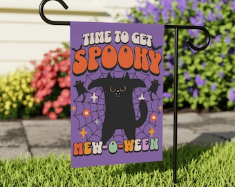 May include: A purple garden flag with a black cat and the text "Time to get spooky mew-o-ween".