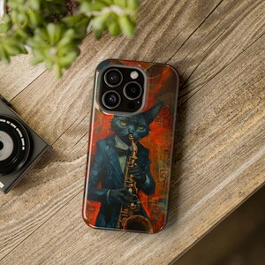 May include: A black cat wearing a tuxedo plays a saxophone. The phone case has a colorful abstract background with red, orange, and yellow hues.