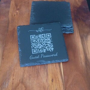 May include: Black slate coaster with a white engraved QR code, the text "wifi" and "Guest Password".