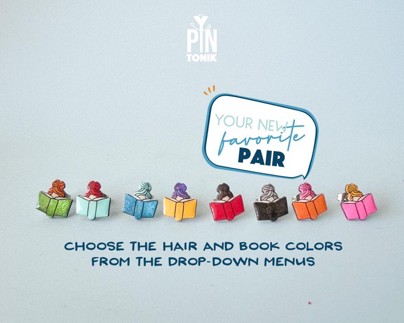 May include: A set of colorful enamel pins featuring a woman reading a book. The pins are available in a variety of hair and book colors. "Your new favorite pair" and "Choose the hair and book colors from the drop-down menus" are written on the image.