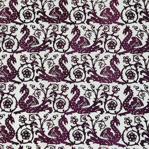 May include: A repeating pattern featuring a stylized dragon design in a deep purple hue against a white background. The dragons are depicted with wings and are interspersed with floral and scroll elements, creating a medieval aesthetic.
