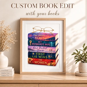 May include: A framed print featuring a stack of five colorful books topped with gold-rimmed glasses. The book titles are The Night We Met, My Husband's Wife, Our Perfect Storm, First Lie Wins, and The Women. The text Custom Book Edit with your books is above.