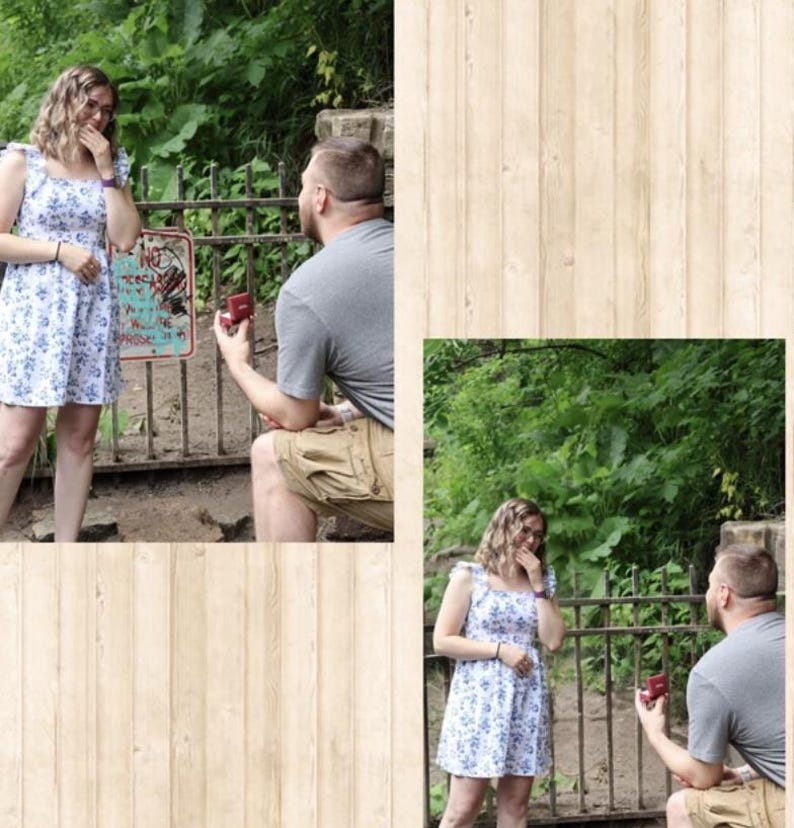 May include: A white sleeveless dress with a blue floral pattern, featuring ruffled shoulder straps and a square neckline. The dress is worn by a person standing near a metal fence while another person kneels, holding a small red ring box.