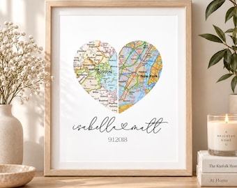 May include: A framed print featuring two map halves shaped into a heart, with the left side showing Boston and the right side showing New York. Below the heart, the text reads "isabella & matt" in script and the date "9.1.2018" in plain font.