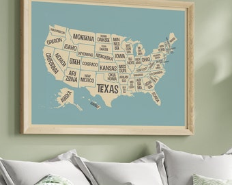 May include: A framed map of the United States with each state labeled in a vintage style font. The map is on a light blue background and the states are beige. The map is framed in a light wood frame.