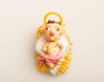 Baby Jesus lying on straws. Original sculpture, cold porcelain.