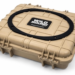 May include: Tan, rugged case with a black rubber gasket. The case has a rectangular shape with a textured surface and secure latches. The text "WILD SOUND 2800 Rugged Durability" is printed on the case.