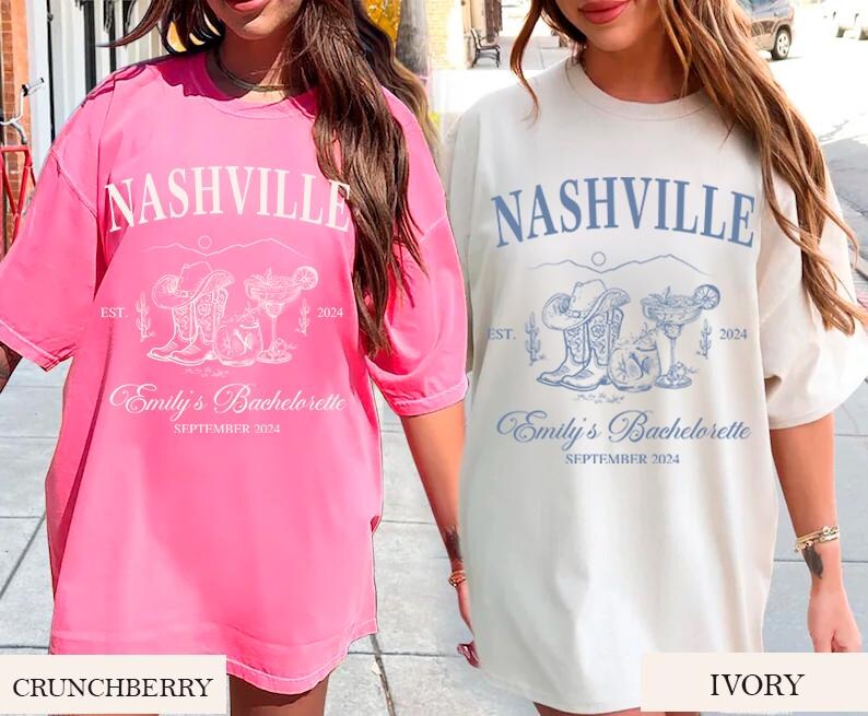 May include: Two oversized t-shirts with a Nashville bachelorette party theme. The t-shirts are in pink and ivory with a graphic of boots, cacti, and a margarita glass. The text on the shirts reads "Nashville", "Est. 2024", "Emily's Bachelorette", and "September 2024".