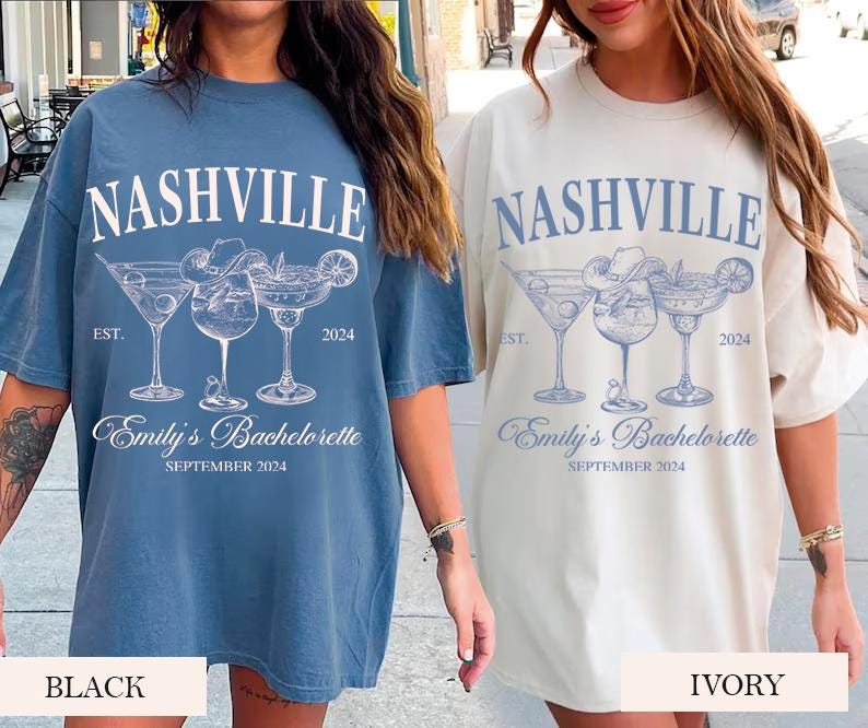 May include: Two oversized t-shirts with a blue and white design featuring the text "Nashville" and "Emily's Bachelorette" with a graphic of three cocktail glasses. The t-shirts are shown in black and ivory.