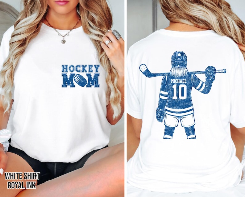 May include: White t-shirt with "HOCKEY MOM" in blue block letters and a hockey puck graphic. The back of the shirt features a blue hockey player graphic with the name "MICHAEL" and the number "10".