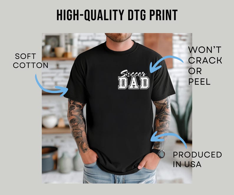 May include: Black t-shirt with the text "Soccer Dad" in white block letters. The shirt is made of soft cotton and is produced in the USA. The print is high-quality and won't crack or peel.