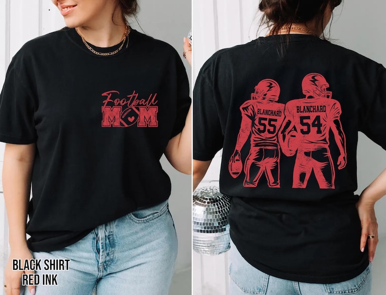 May include: A black t-shirt featuring red ink graphics. The front displays the text Football MOM with a football icon. The back shows two football players in helmets and jerseys with the name BLANCHARD and the numbers 55 and 54 in red ink.