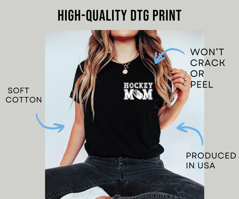 May include: Black t-shirt with the text "HOCKEY MOM" in white, featuring a hockey puck graphic. The image also includes the text "HIGH-QUALITY DTG PRINT", "SOFT COTTON", "WON'T CRACK OR PEEL", and "PRODUCED IN USA".