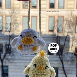 Crochet PDF Pattern for little baby yellow chicken with with yellow orange feathers and white baby duck with orange beak. These two baby animals are joined with crocheted chain to be used as car rear mirror hanger, or to be hanged anywhere in general