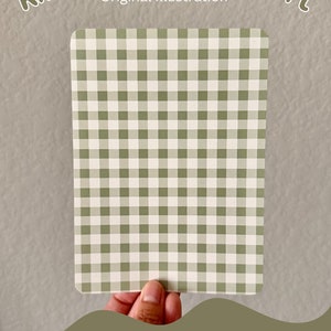 May include: A green and white gingham pattern cardstock insert for a Kindle. The text "Kindle Cardstock Insert" and "Original Illustration" is at the top of the image. The text "Pattern B" is at the bottom of the image.