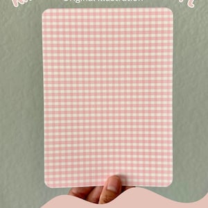 May include: A pink and white gingham pattern cardstock insert for a Kindle. The insert is held in a hand and the text "Pattern E" is visible below the insert.