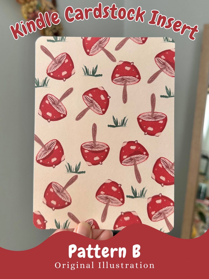 May include: A printable cardstock insert for a Kindle featuring a pattern of red and white mushrooms on a cream background. The text "Pattern B" and "Original Illustration" is printed at the bottom of the insert.