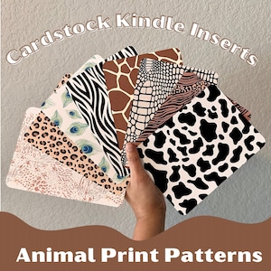 May include: A set of seven cardstock inserts featuring animal print patterns. The patterns include zebra, leopard, giraffe, cow, snake, peacock, and a pink and brown abstract pattern. The inserts are designed to fit a Kindle e-reader.