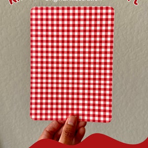 May include: Red and white gingham pattern cardstock insert for a Kindle. The insert is held in a hand. The text "Pattern D" is at the bottom of the image.