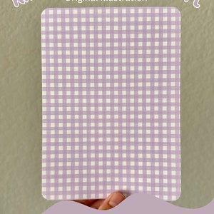 May include: A purple and white gingham pattern cardstock insert for a Kindle. The text "Kindle Cardstock Insert" and "Original Illustration" is at the top of the image. The text "Pattern F" is at the bottom of the image.