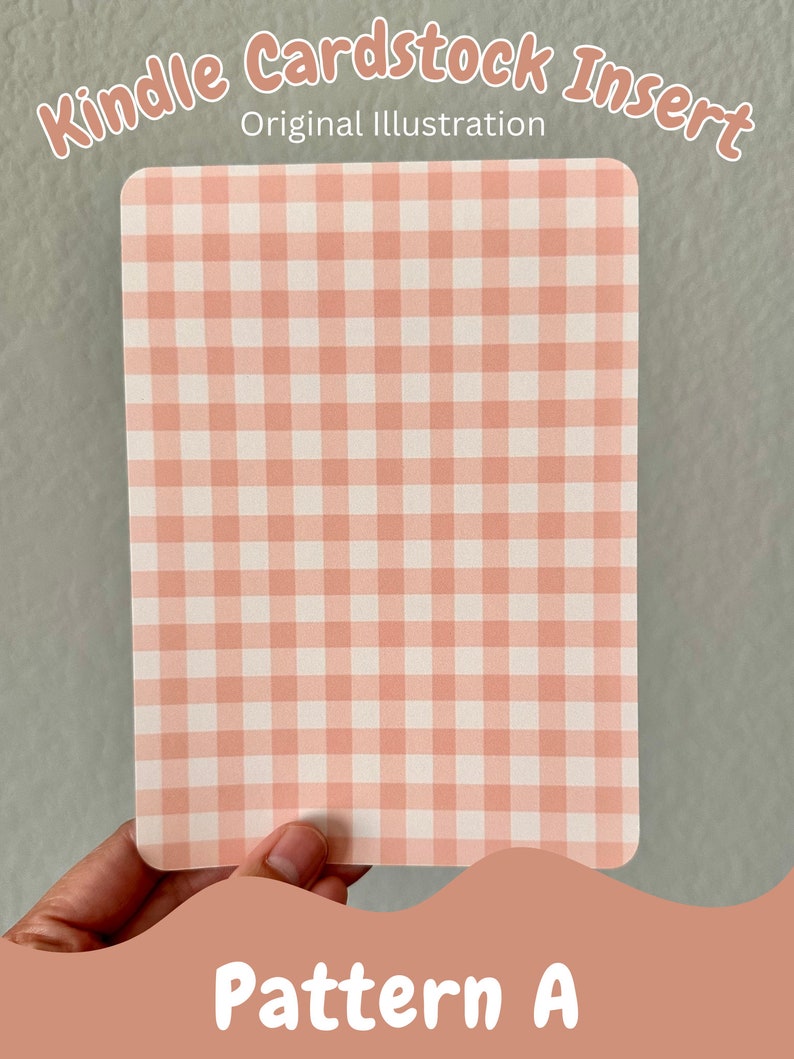 May include: A pink and white gingham pattern cardstock insert for a Kindle. The insert is held in a hand and the text "Pattern A" is visible at the bottom of the image.